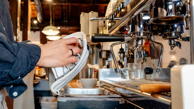 Barista preparing coffee in cozy South Korean cafe