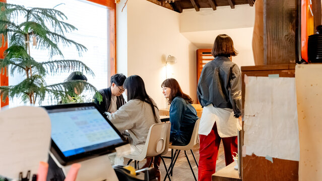 Busy korean coffee shop interior with patrons relaxed