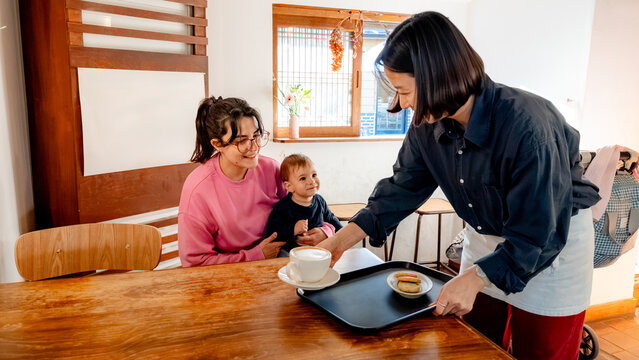 Family enjoying coffee in a cozy Korean cafe