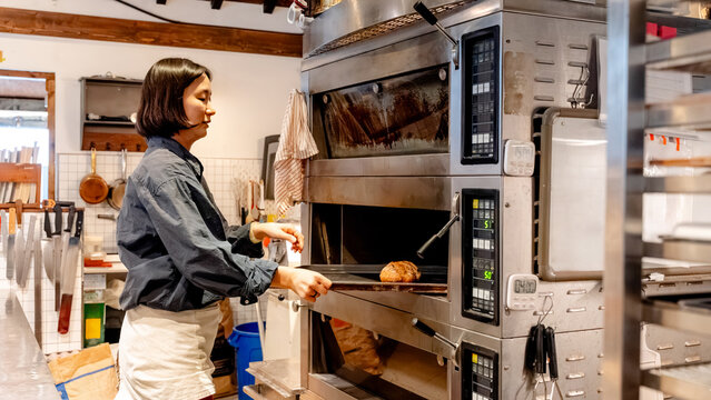 Woman baking bread in a South Korean coffee shop