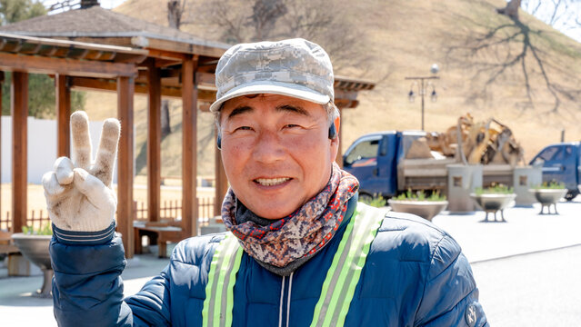 Road repair worker posing during a break in Gyeongju