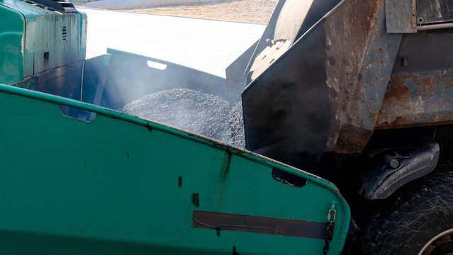 Road equipment for asphalt paving operation