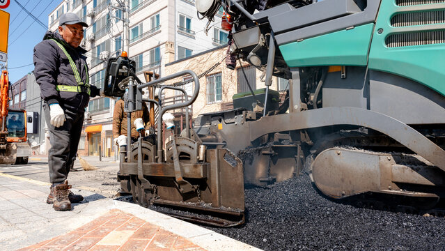 Asphalt paving process on a street in Gyeongju