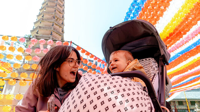 Mother and child bonding at colorful Jogyesa Temple