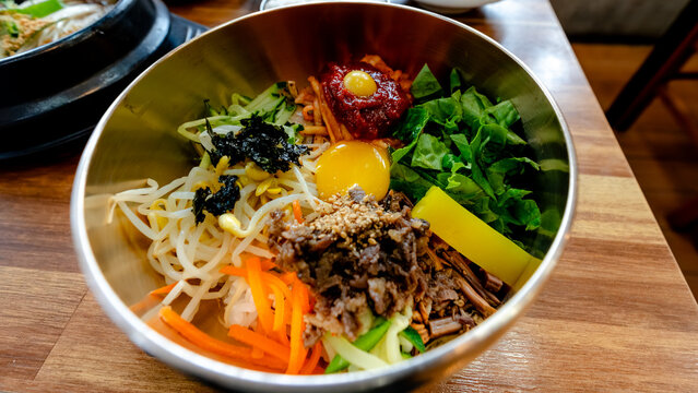 Jeonju bibimbap bowl with Obangsaek colors and egg