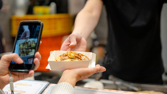 Taiwanese night market scallion pancake served to customer