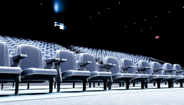 Empty movie theater with rows of comfortable seats