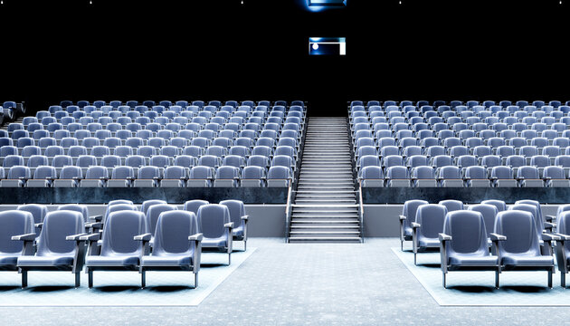 Empty movie theater with rows of seats