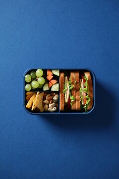 Blue bento box with a healthy, balanced meal