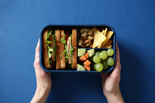 Blue bento box with a healthy balanced meal