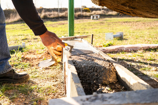 Concrete work during outdoor construction of a foundation form