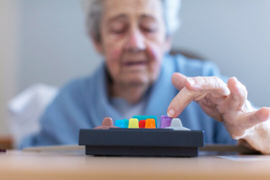 Elderly patient engaging with hospital device