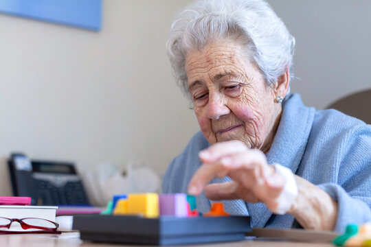 Elderly patient engaging in cognitive exercise at hospital