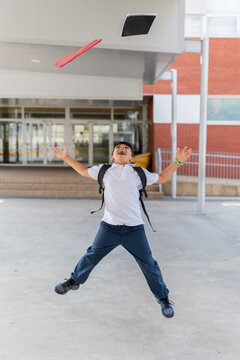 Joyful schoolboy celebrates last day with enthusiasm