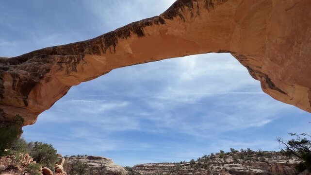 Hiking in Natural Bridges near Blanding, Utah, sandstone arches, cliff dwellings and desert landscape