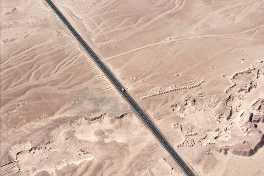 Aerial view of scenic road crossing the Atacama Desert
