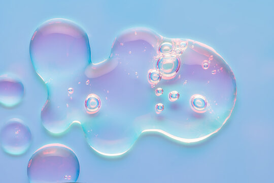Iridescent cosmetic serum drops in neon pastel lighting