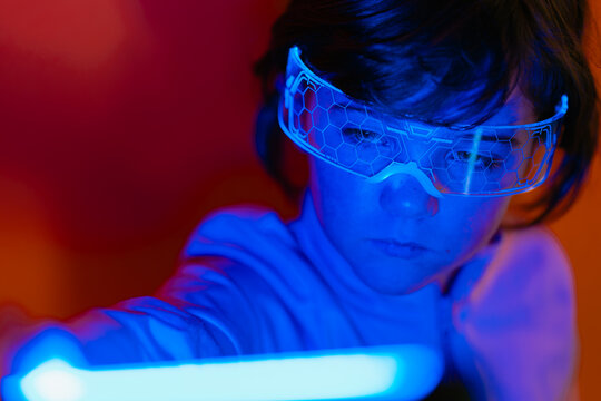 Girl wearing smart glasses exploring futuristic light tech