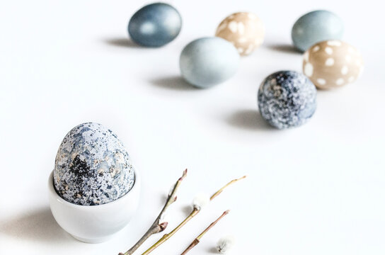Easter egg composition with pastel eggs on white backdrop