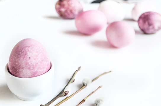 Minimal Easter egg composition on white background with space