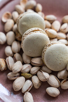 Delicious pistachio macarons with scattered pistachios