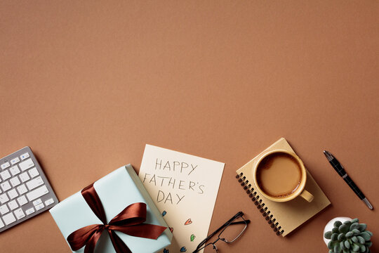 Father's Day gift and office accessories on brown background. Top view flat lay
