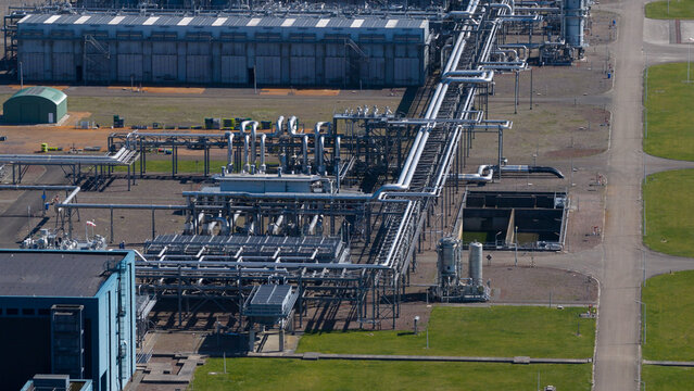 Aerial view of the NAM Grijpskerk UGS industrial facility with complex piping networks and large storage buildings Grijpskerk, Groningen, Netherlands.