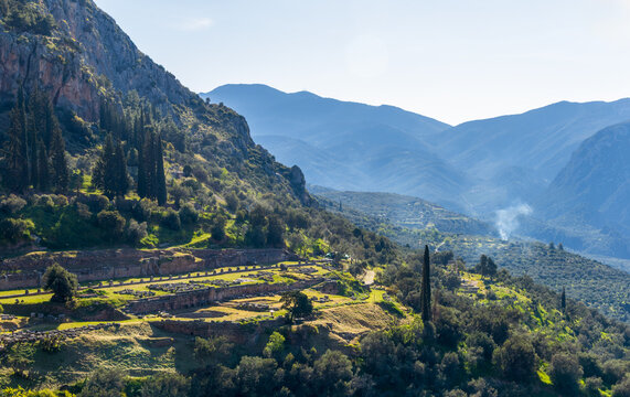 Distance view of the sanctuary complex and Tholos of Athena Pronaia near Delphi, Greece