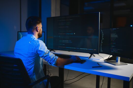 smart skilled introvert tester write typing operating data security evening office dark room