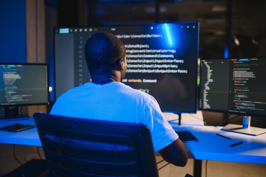 smart skilled introvert tester write typing operating data security evening office dark room