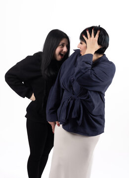 Woman measuring waist while standing and checking fitness results in professiona