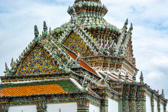 Ornate roofs and polychrome ceramic decorations at Wat Phra Kaew, Bangkok