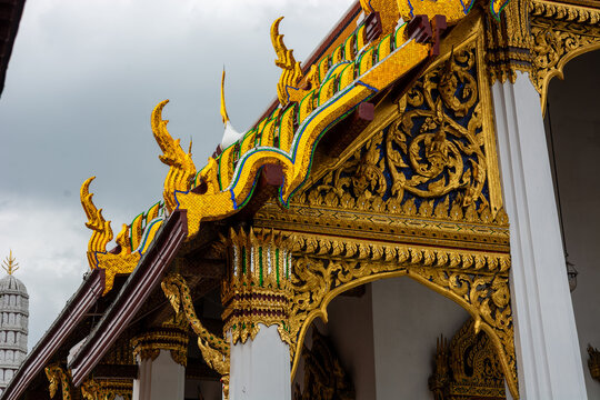 Golden roof with chofa and decorated gable at Wat Phra Kaew, Bangkok