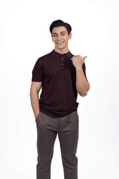 Man giving thumbs up while gesturing approval and success smiling in professiona