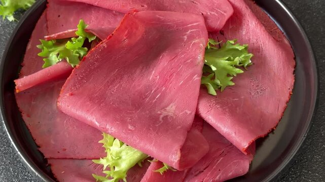 Beef ham thin slices of veal ham meat dish lunch or dinner tasty snack fresh, delicious, gourmet food background on the table rustic food close-up copy space