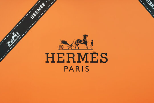 Nice, France - April 17, 2026: Hermes Paris luxury brand logo on orange temporary storefront covering during boutique renovation at Nice Cote d Azur Airport