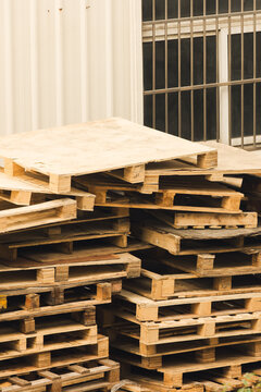 Stack of wooden pallets in industrial storage environment