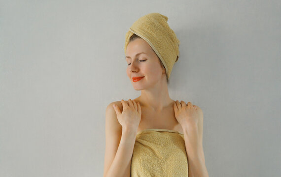 Beauty portrait of happy young caucasian woman touches her clean skin