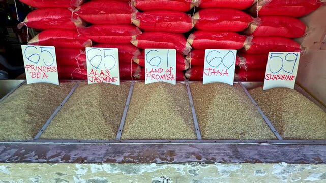Packaged grains or rice arranged in rows on market shelf in Surigao Philippines