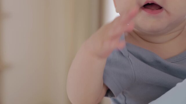 Caucasian parent captures playful baby expressions and gestures, surprise frown and puckered lips, reaching hand and curious eyes, closeup portraits, developmental