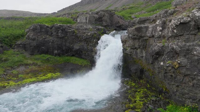 Wild G&ouml;ngumannafoss waterfall on a summer evening located in the west Fjords of Iceland. It is one of the smaller waterfalls below the Dynjandi.