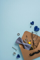 Naklejka premium Happy Father's Day vertical gift envelope with bow tie, tools, glasses and mustache card
