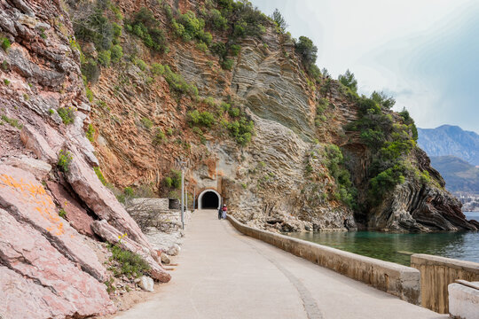 Rock Tunnel Walking Path Along the Sea in Rafailovici, Montenegro