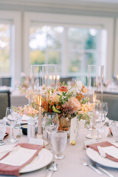 Soft lighting combined with floral arrangements creates sophisticated intimacy