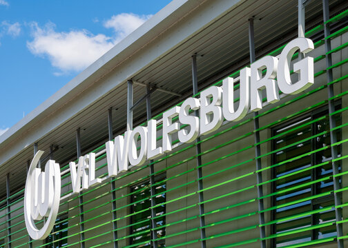 WOLFSBURG, GERMANY, 26 April 2026: VfL Wolfsburg football club logo on stadium Wolfsburg Arena building against blue sky