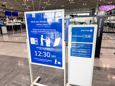 Narita, Japan - April 29, 2026: Instructions for United Airlines passengers checking bags at the counter at NRT Narita International Airport Tokyo