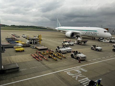 Narita, Japan - April 29, 2026: A ZipAir airplane at the gate at NRT Narita International Airport Tokyo