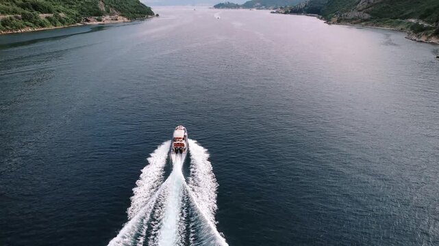 Dynamic shot capturing man speeding across water. Highenergy image of man controlling sport boat at full speed