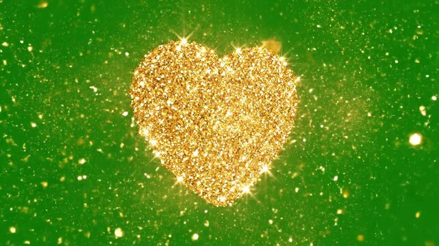 A shimmering, golden cluster of sparkling particles forms a stylized heart shape against a vibrant green background, creating a magical and celebratory visual effect.