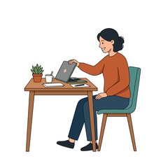 Fototapeta premium Woman working on a laptop at a desk with a plant